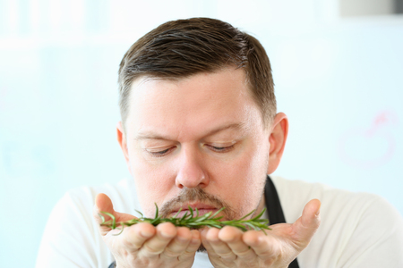 Blogger Beard Chef Smelling Aromatic Rosemary Herbの写真素材