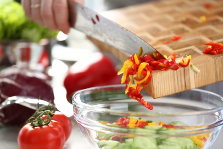 Colorful Yellow Chopped Chili Pepper Pouring Bowl