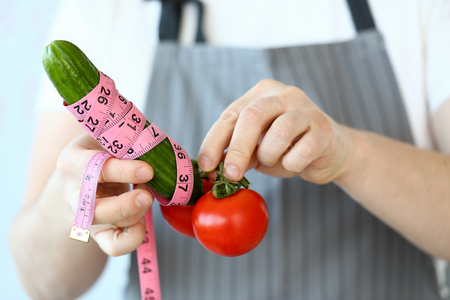 Culinary Chef Measure Green Cucumber Penis Sizeの写真素材