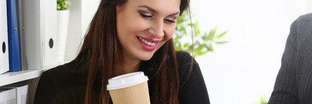 Group of people in office look at mobile tablet pcの写真素材