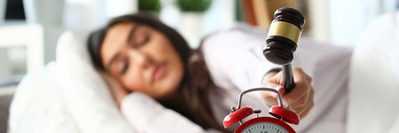 Sleepy young woman portrait with oneの写真素材
