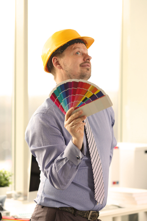 Male Caucasian Decorator Holding Colour Swatchesの写真素材