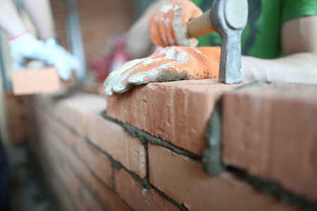 Careful man with hammerの写真素材