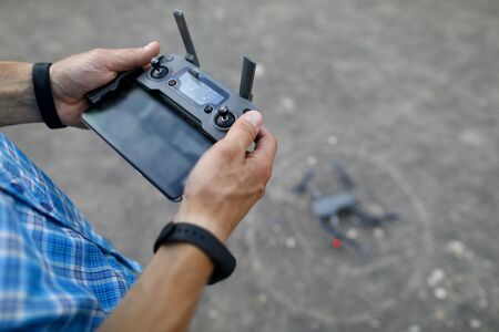 Modern with hand remote copter on grayの写真素材