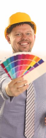 Graphic Designer Work on Project with Color Chart