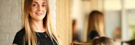 Young Hairdresser Styling Haircut for Girl Clientの写真素材