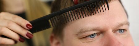 Making Haircut for Man Client in Barbershop Salonの写真素材