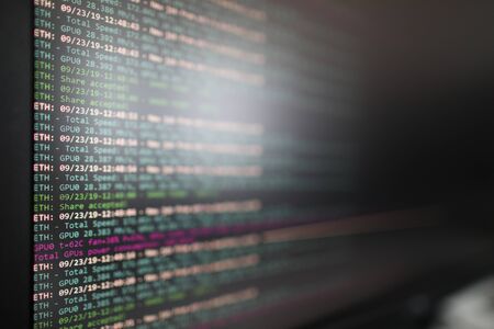 Program for mining cryptocurrencies on a computer monitor closeup background