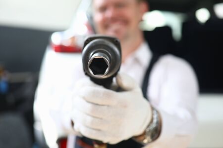 Focus on special automotive utility used for taking out titanic discs and tires of damaged and expensive vehicles and automobiles. Automobile checkup conceptの写真素材