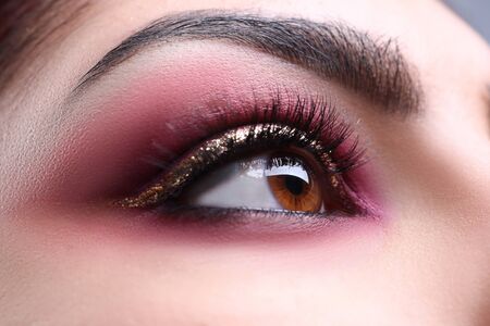 Make-up eye of young attractive woman beauty portrait. Print for showcases of cosmetic stores...