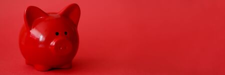 Red piggy box background. Fast banking credit money conceptの写真素材