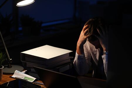 Portrait of businessman closing tired eyes trying to have sweet slumber after tiring day full of...