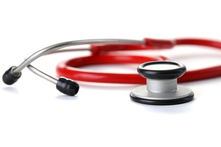 Red stethoscope with black silver head isolated on whote background. Medical education object conceptの写真素材