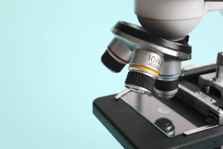 Chemistry microscope on modern blue background. Pharmaceutical industry concept