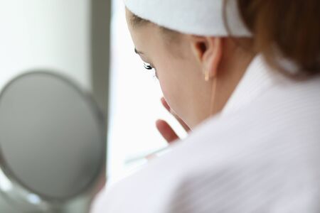 Woman make home spa chocolate mask portrait.の写真素材