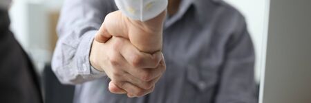 Two busineesman hand shake against office background. Business education cincept