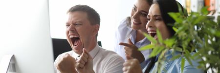 Group people in office correctly solved problem and shout yes we won. Business staff succes celebration unity achievement. Big total sale conceptの写真素材