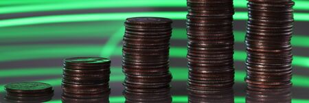 Focus on charts and graphs showing corporation income growth stacking metallic coins initially...