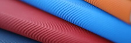 Stack of colorful books lies on a table closeup background. Business education concept