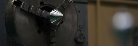 Focus on special workshop utility nested into modern factory and used for cutting steel rods and...