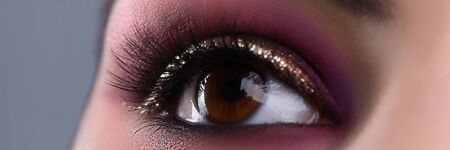 Make-up eye of young attractive woman beauty portrait. Print for showcases of cosmetic stores...