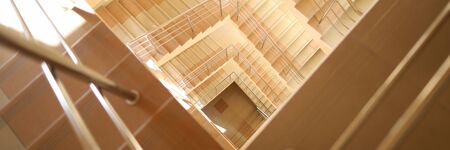 Close-up of stairway with railing. Architecture and design of interior. Construction with steps made...