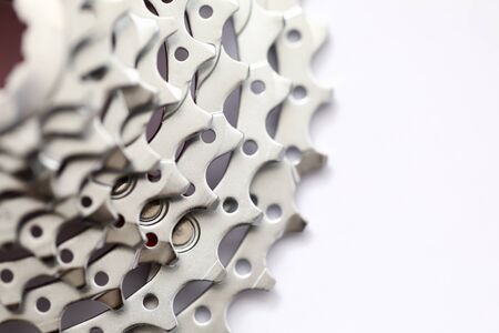 Large number metal gear sprocket for bicycle. Detail with pointed teeth for bicycle or motorcycle. High quality gear sprocket with thread. Part for repairing bicycle or motorcycle.の写真素材