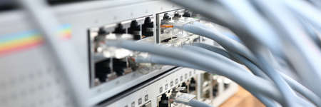 Focus on internet chords and cables perform role of porter of ethernet connection and wi-fi provider at back of modem server Computer technology conceptの写真素材