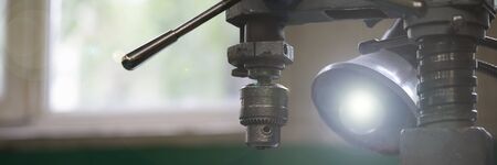 Focus on nested workshop utility used for cutting steel rods and making new automobile details out...