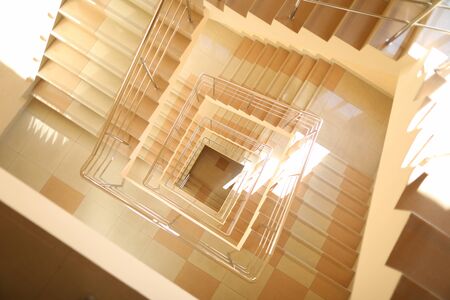 Staircase multi-storey building, tiled floor. Development human mind. Progress in science and technology. Development productive forces society. Increasing adaptive capabilities. Career ladderの写真素材