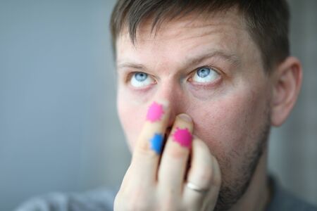 Man touches nose, on hands microbe of coronavirus. Patients condition worsens rapidly. Wash hands...