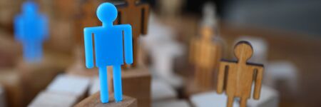 Figures people for presentation wooden and plastic. Manipulative methods influencing people. Power over other people. Selection qualified personnel. Influencing people. Creating business presentationsの写真素材