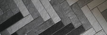 Close-up laid ceramic granite tiles for outdoor use. Technology of laying granite tiles....