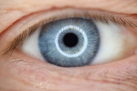 Blue male, human eye closeup super macro. Laser correction vision conceptの写真素材