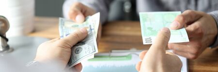 Profit according to progress report, cashing out. Implementation volumetric planning sales and operations. Exchange notes dollars euros. Costs running pilot project. Investment in starting business.の写真素材