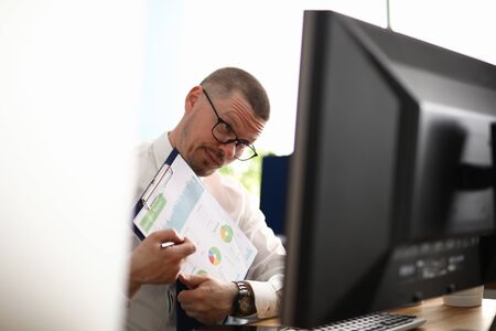 Portrait of male explain business plan to colleague. Smart middle-aged company worker in stylish glasses. Conference meeting. Video call. Business and economy conceptの写真素材
