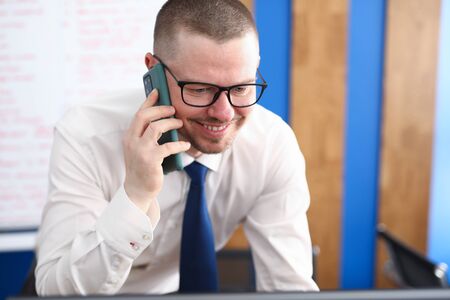 Portrait of smiling person talking on mobile phone and decide important question. Happy cheerful...