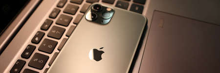 Minsk, Belarus - 11 December 2019 : Apple iphone pro on laptop keyboard. Illustrative editorialのeditorial素材