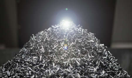 Close up of pile of metal waste lying on floor after some construction work indoorsの写真素材