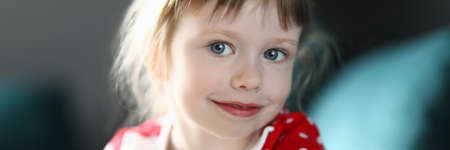 Happy child girl portrait against home background.