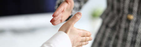 Man and woman extend their hands in greeting. Business process management specialist. Supporting...