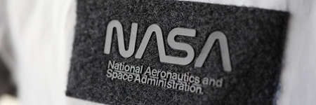 Minsk, Belarus - July 2 2020 : Nasa National Aeronaitics space Administration patch on silver spacesuit closeup. Illustrative editorial.のeditorial素材