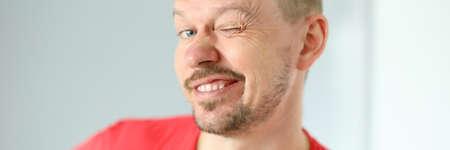 Portrait of funny cute man posing on camera. Joyful person making faces. Mature middle-aged male in...