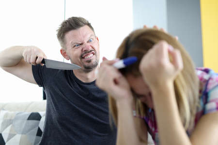 Angry husband threatens to stab his wife with pregnancy test in apartment. Domestic violence in...