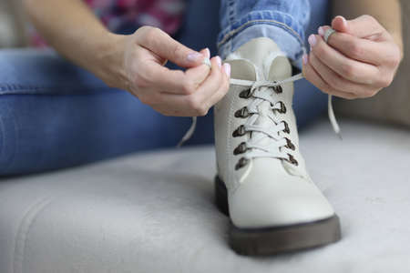 Light colored shoe on which lace is tied. Fashion trends in the shoe industry conceptの写真素材
