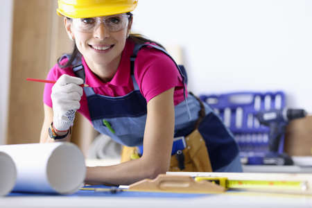 Woman architect makes plan for the design of an apartment. Design and renovation of apartments...