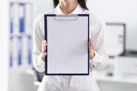 Businessman is holding klebold with white blank sheet. Conference recordings conceptの写真素材