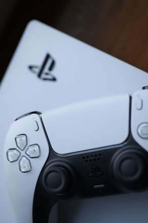 Minsk, Belarus - November 21 2020 : White sonyplaysation 5 gamepad closeup background. Illustrative editorial.のeditorial素材