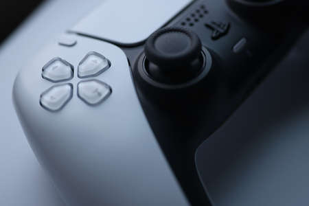 Minsk, Belarus - November 21 2020 : White sonyplaysation 5 gamepad closeup background. Illustrative editorial.のeditorial素材