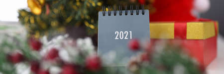 Christmas and New Year decorations on table with calendar for 2021. New year and christmas...
